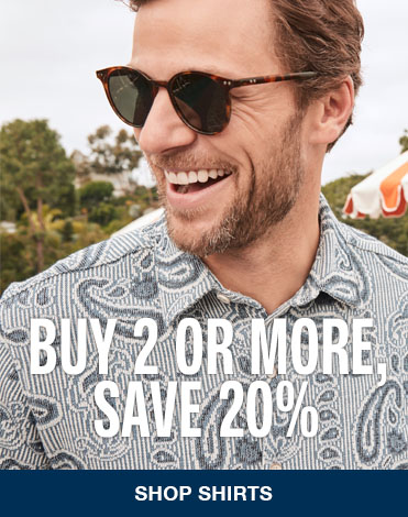 A close up image of a man wearing a light blue paisley colored shirt with sunglasses on. The words 