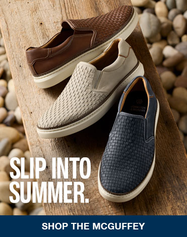 Three pairs of men's woven loafers are shown on a wooden bench with rocks and gravel in the background. The words