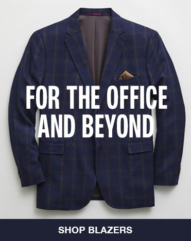 Laydown shot of a men's navy plaid blazer with words that say 