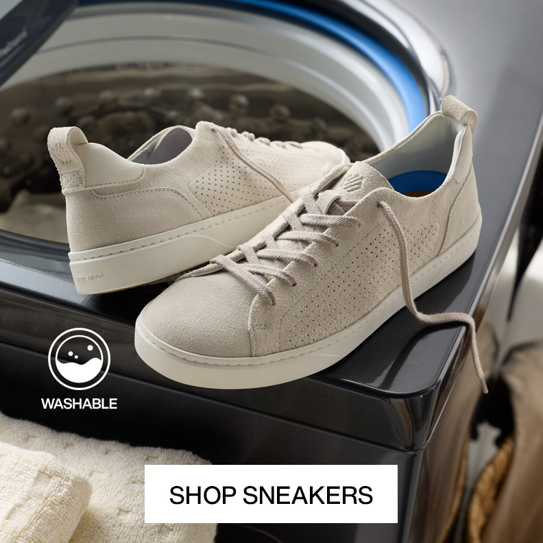 A detailed image of two men's sneakers covered in rain drops to showcase that they are waterproof with a Shop XC+ Shoes button at the bottom of the image.