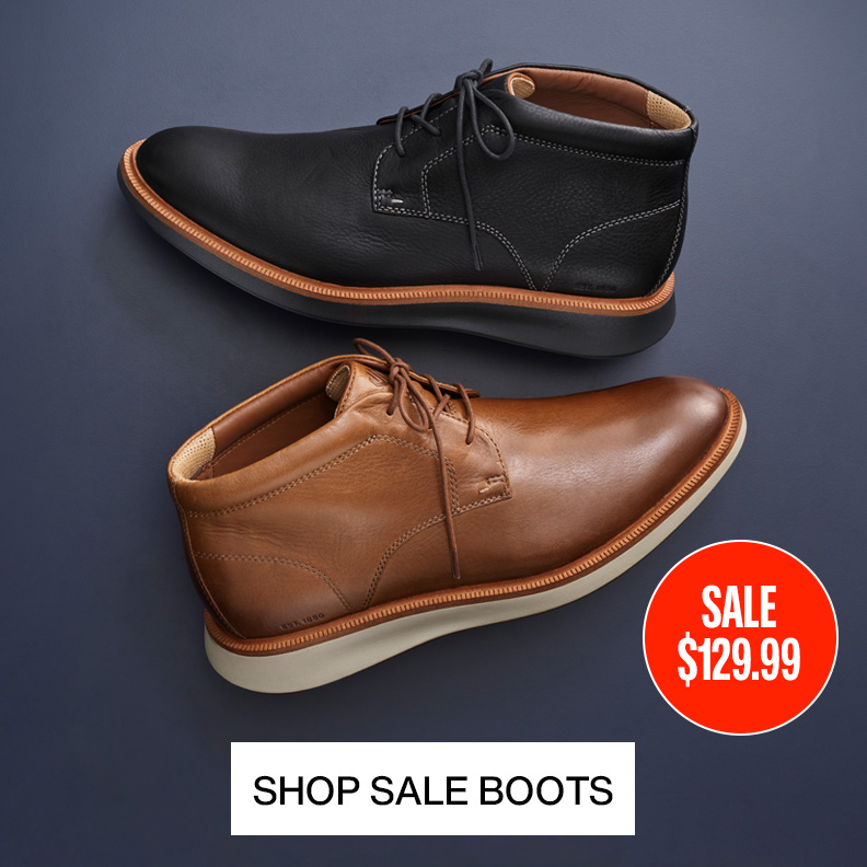 Flatlay of two men's lace-up chukka boots on a blue background with a sale price sticker on the image.
