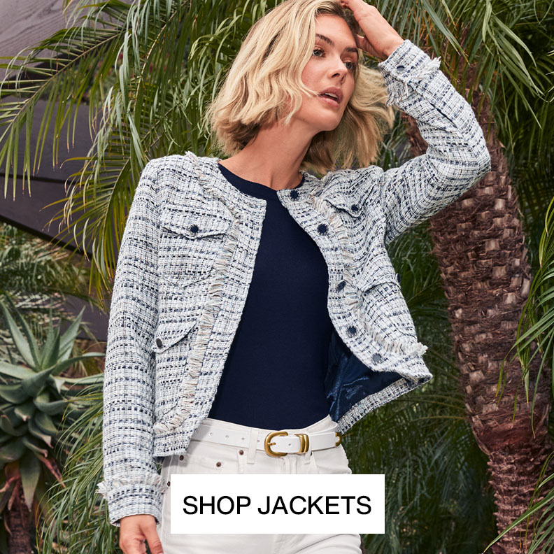 Woman wearing a cream colored monochormatic outfit with a blazer, shirt, and pants.